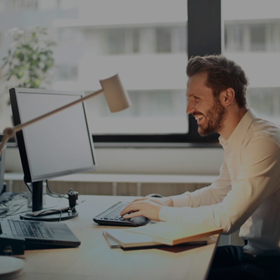 Man smiling on computer